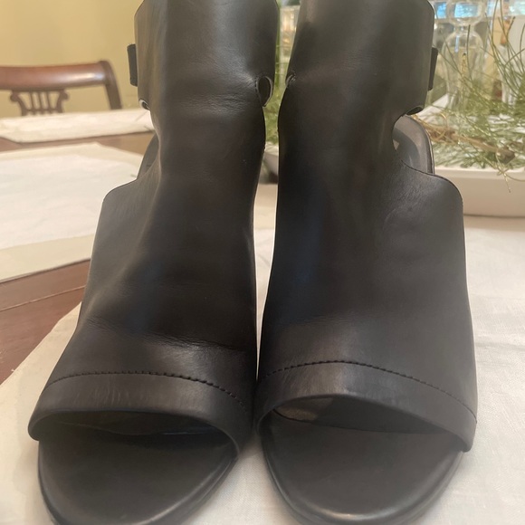 Black stacked heel. Heel/toe out. Ankle fasten. Very comfortable. Preowned - Picture 3 of 5